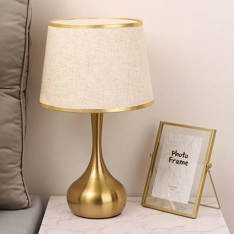 Sophisticated table lamp Luminis golden metal base fabric shade cozy ambiance - view 8