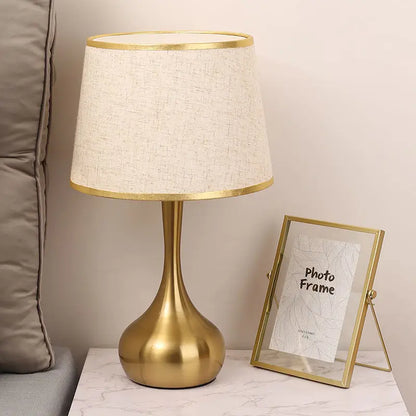 Sophisticated table lamp Luminis golden metal base fabric shade cozy ambiance - view 8